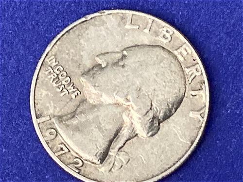 1972-No-Mint-Mark-Quarter-Seems-To-Be-Struck-Over-Another-Coin?